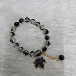 Beaded bracelet with leaf shaped charm