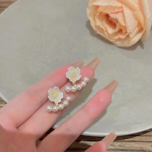 White flower and pearl ear jacket earrings