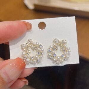 Crystal bow and pearl stud