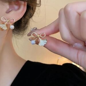 Gold bow and pearl drop stud